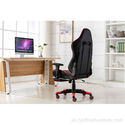 Silla roja para juegos de computadora con reposapiés y respaldo de almohada